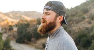 John Crestani outside looking dapper with his manly-mans mountain beard